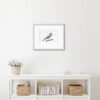 Wordy Blue Tit. Colour pencil blue tit drawing as A4 print. Descriptive blue tit words around edge of print. Framed and mounted in a natural colour room setting