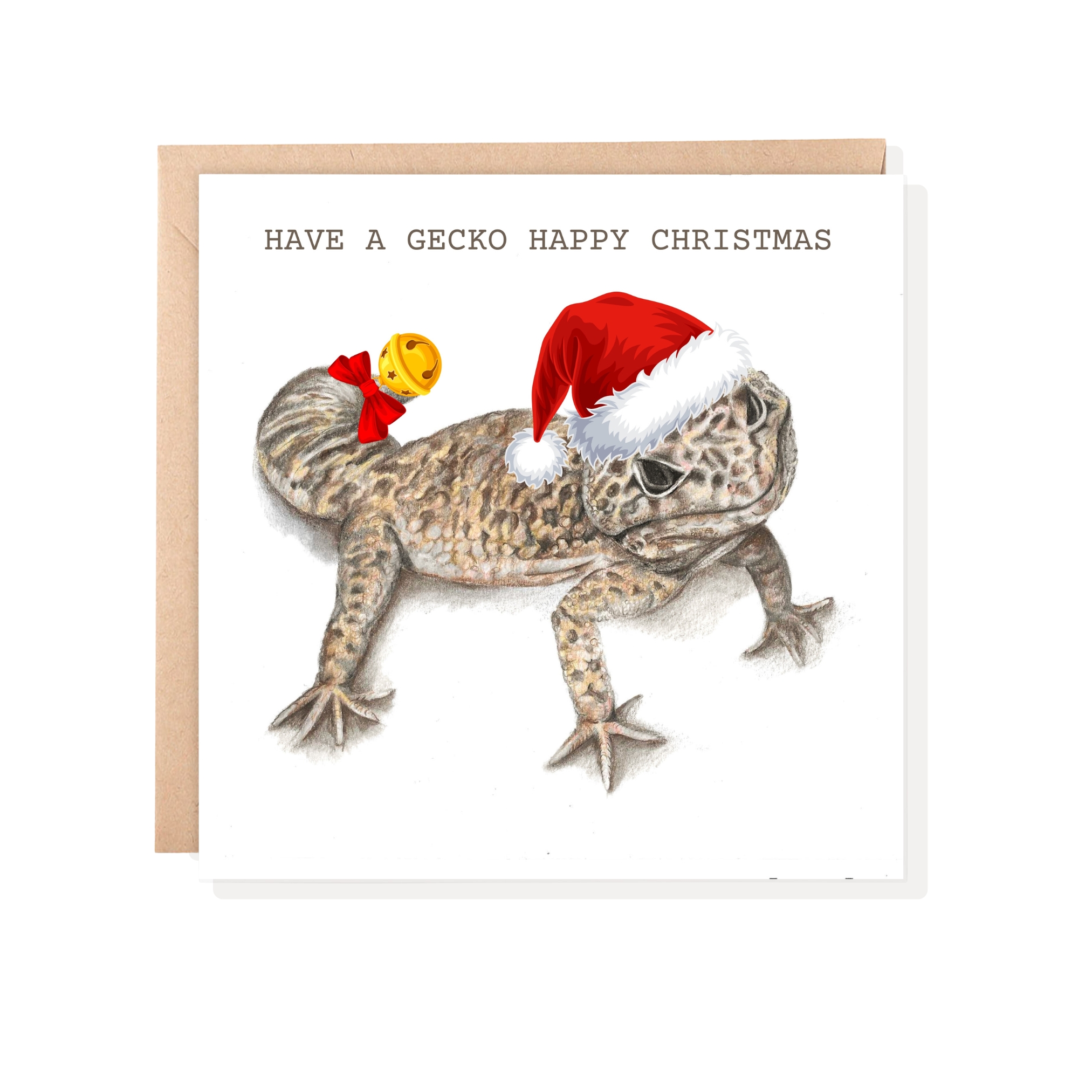 Colour pencil drawing of a Leopard gecko with Santa hat and bell on a greetings card with brown envelope